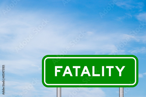 Green color transportation sign with word fatality on blue sky with white cloud background photo