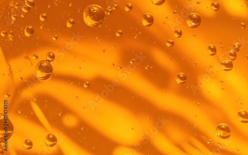 Texture of transparent yellow gel with air bubbles and waves on orange background