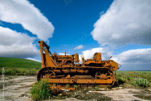 Large bulldozer near a field; Umnak Island, Aleutian Islands, Alaska, United States of America
