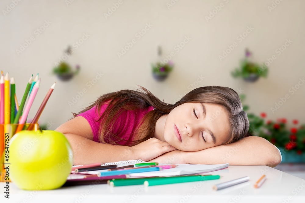 Sad school child studying at home Sad school child studying at home