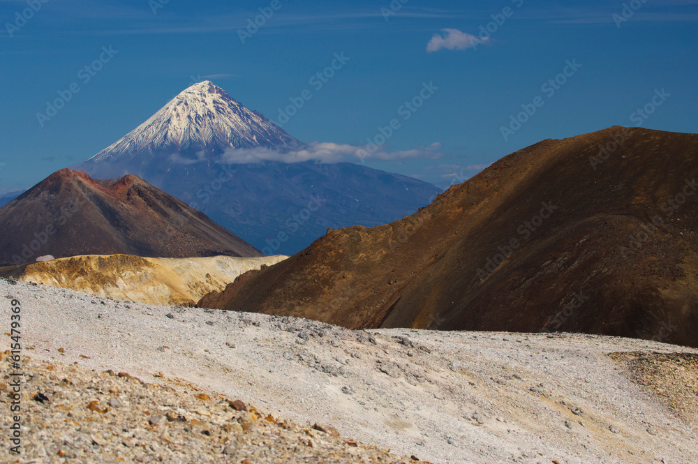 Snow-covered Kronotsky volcano rises in the distance, Russia; Kronotsky Zapovednik, Kamchatka, Russia Snow-covered Kronotsky volcano rises in the distance, Russia; Kronotsky Zapovednik, Kamchatka, Russia