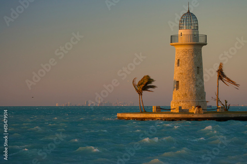 Boca Chita Lighthouse and palm trees on a windy day in Boca Chita Key, Biscayne National Park, Florida, USA; Florida, United States of America photo