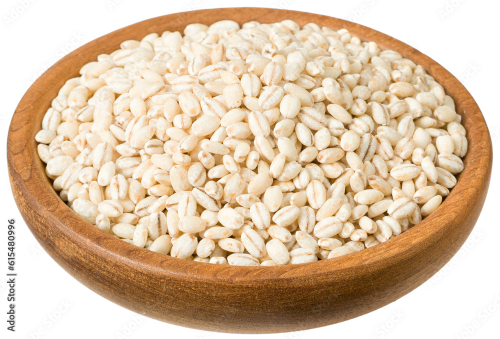 Uncooked highland barley in the wooden plate, isolated on white background. Uncooked highland barley in the wooden plate, isolated on white background.