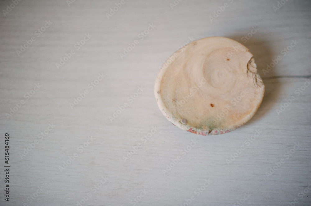 The wooden surface on which the old round stone lies. The wooden surface on which the old round stone lies.
