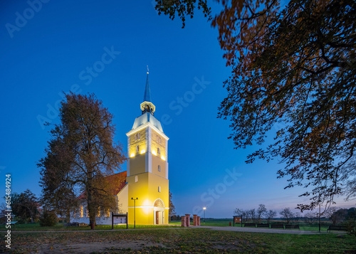 Illuminated Mežotne Lutheran Church in Latvia at night