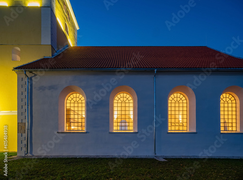 Illuminated Mežotne Lutheran Church in Latvia at night
