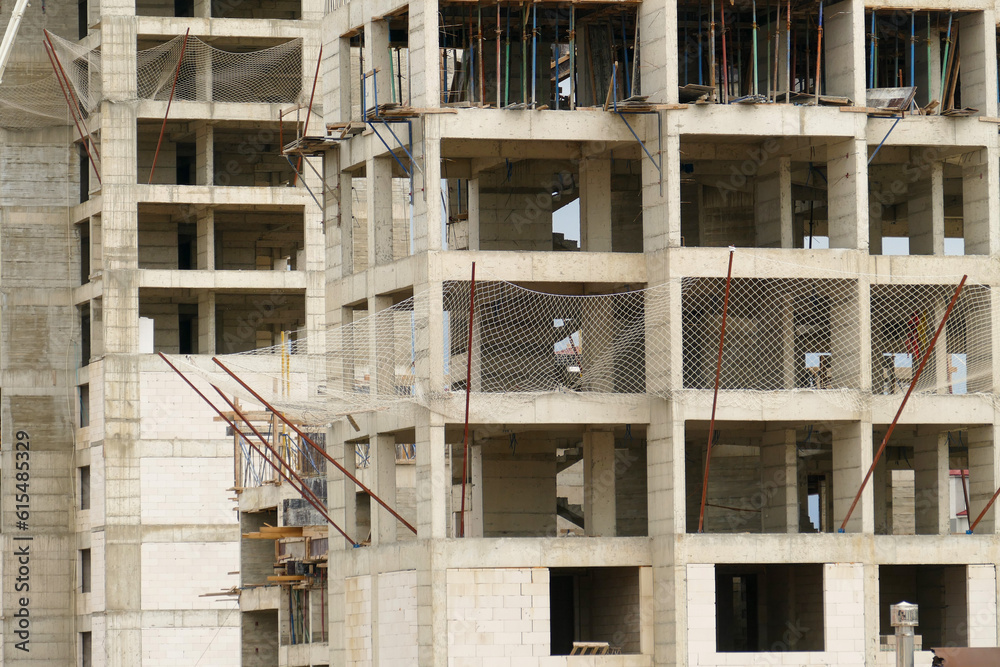 building construction and safety net, building construction and workers, which are secured by a protection net, building construction and safety net, building construction and workers, which are secured by a protection net,