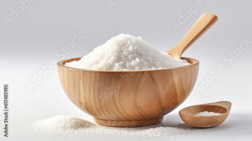 The sugar in a wooden spoon on isolated background