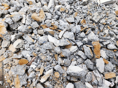 Breaking down the walls of old buildings for new construction. Scrap materials can used to replace the soil in empty areas. Pile of concrete debris at a construction home site.Building demolition, 