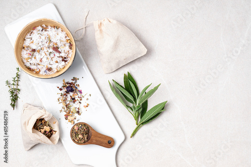 Wallpaper Mural Botanical blends in cotton bags, salt, herbs, essencial oils for naturopathy. Natural remedy, herbal medicine, blends for bath and tea on wooden table background Torontodigital.ca