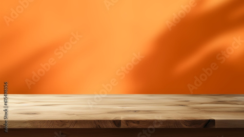 Empty wooden table on abstract orange background for product presentation, space for a montage showing the product