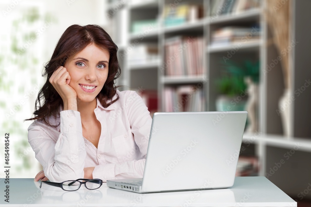 Joyful happy freelance worker works at laptop in office Joyful happy freelance worker works at laptop in office