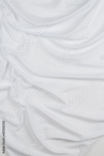 white cotton fabric draped  bed linen