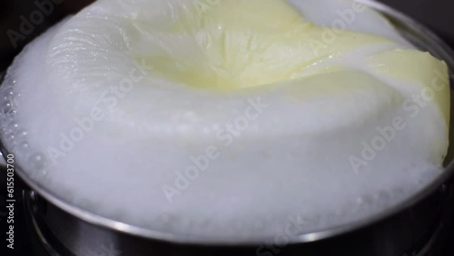 Boiling of milk in a vessel. A symbol of auspiciousness in dedication of houses, house warming, cooking, healthy and baby food. Milk processing for pasteurization.