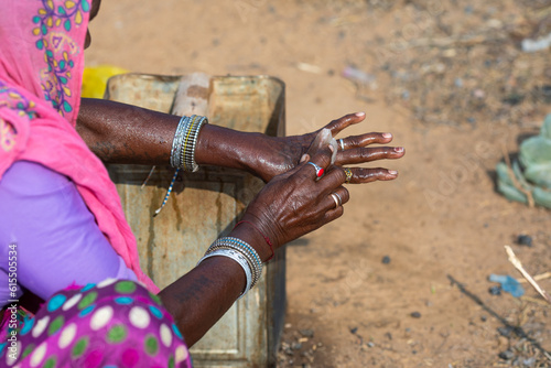 Photography Indian Rural Woman Cleaning Hand in Desi Style