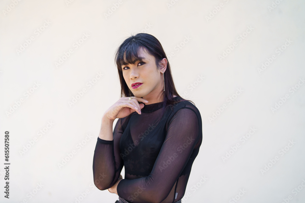 Naklejka premium Portrait of Happy Asian transgender. LGBTQIA wearing make up woman clothes.