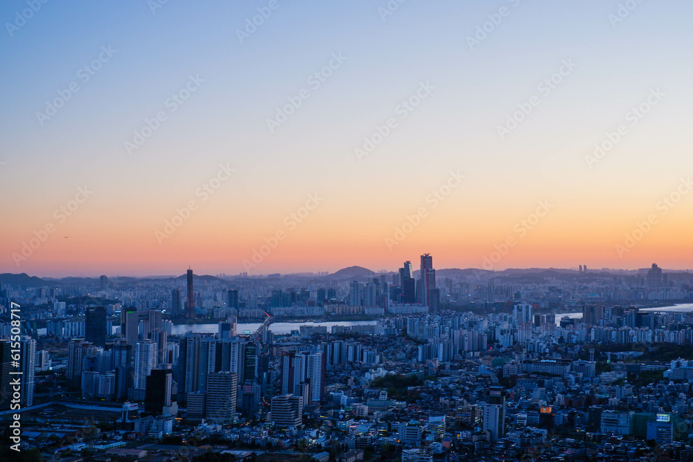 Inwangsan mountain, Seoul City view looking at seoul tower at sunrise in South Korea.