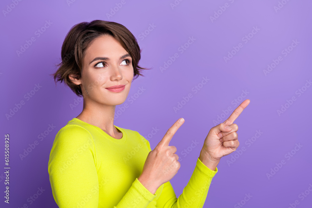 Photo of young girl wear top look interested recommend her new job workshop direct fingers look mockup isolated on purple color background Photo of young girl wear top look interested recommend her new job workshop direct fingers look mockup isolated on purple color background