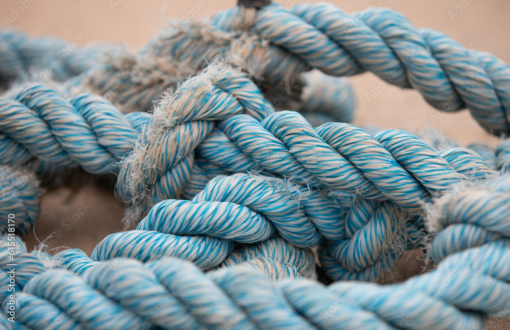 Thick Blue Nautical Rope. Closeup of an old blue frayed boat rope. 