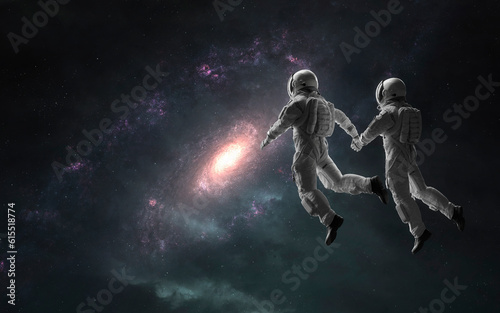 Astronauts couple in deep space. 5K realistic science fiction art. Elements of image provided by Nasa