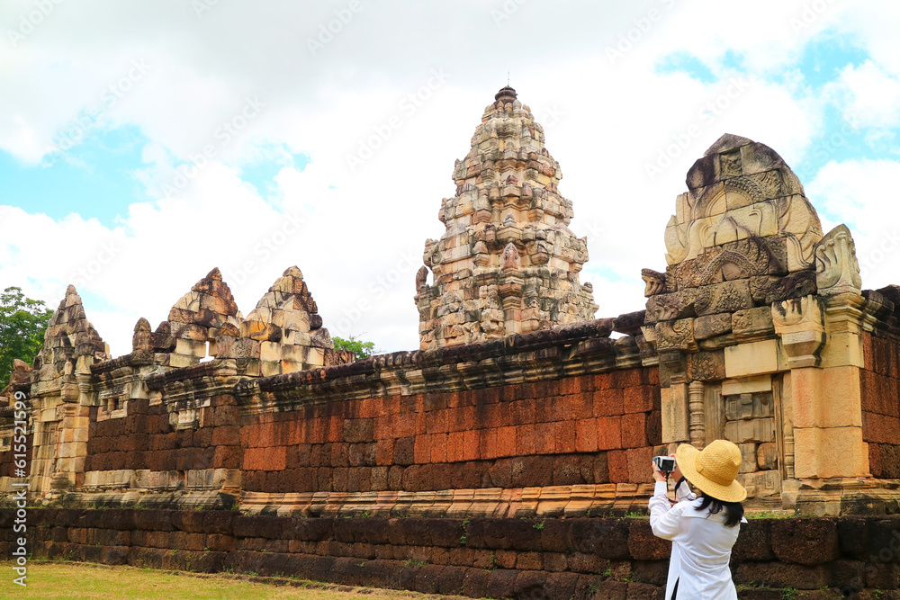 Female Traveler Taking Photos of Prasat Sdok Kok Thom Khmer Temple, Located in Sa Kaeo Province, Thailand