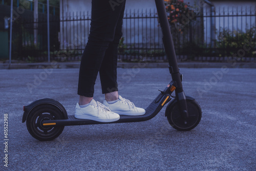 Girl riding an electric scooter