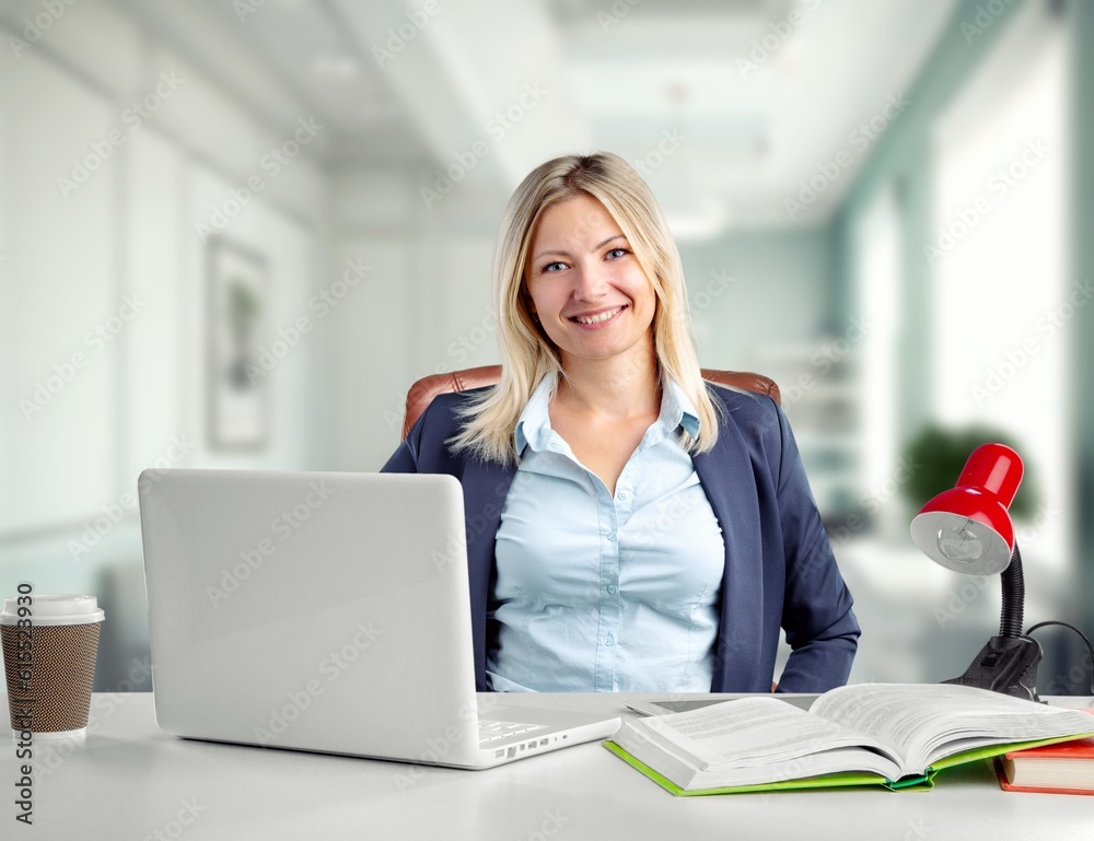 Young smiling business person or student  work on computer