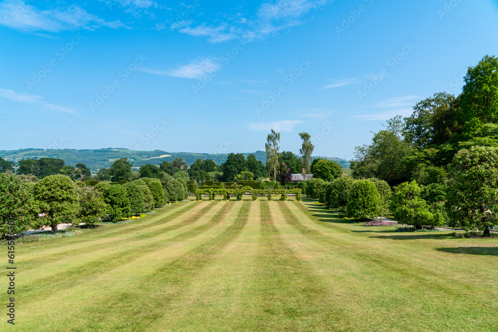 Sunny day with a clear blue sky in the gardens of the Powis Castle in the UK