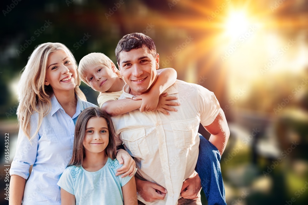 Obraz premium Cute happy family having fun at beautiful nature