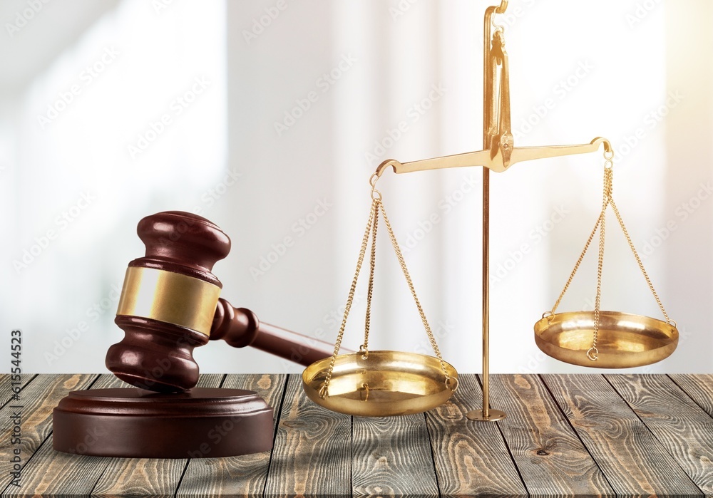 Lawyer wooden hammer on table in office