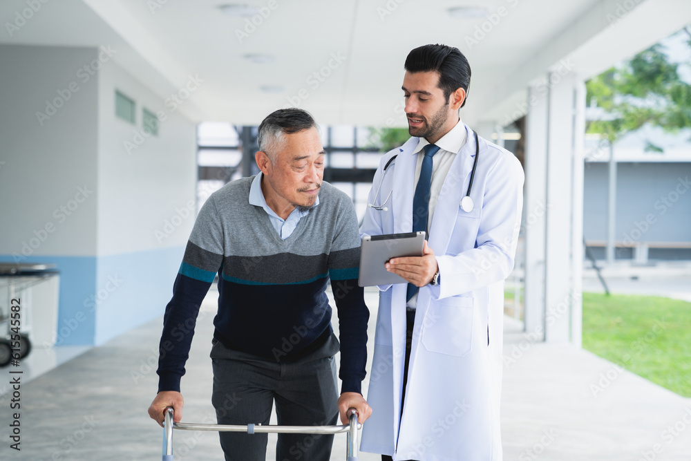 Yong male doctor consulting senior man at hospital. Medical staff explaining diagnosis to patient. Medicine and healthcare concept. Yong male doctor consulting senior man at hospital. Medical staff explaining diagnosis to patient. Medicine and healthcare concept.