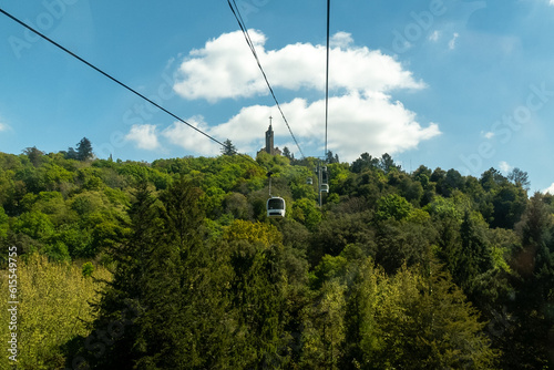Guimaraes, Portugal. April 14, 2022: Panoramic of Guimaraes and cable car of the city with beautiful blue sky.