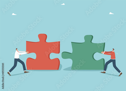 Collaboration or partnership in achieving common goals, brainstorming to create business ideas or strategy, teamwork to achieve the best result and great success, two businessmen put together puzzles. photo