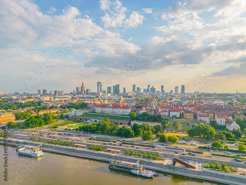 Aerial panorama of Warsaw, Poland over the Vistual river and City center in a distance Old town. Downtown skyscrapers cityscape. Business