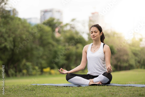 Woman Yoga - relax in nature. beauty woman doing yoga at park. woman practising yoga at park..