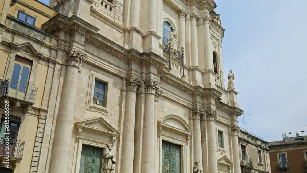 The Metropolitan Cathedral of Saint Agatha in the old town of Catania, Sicily. Prominent baroque cathedral with columned facade, domed roof, frescoes, and stunning paintings in Italy. The Metropolitan Cathedral of Saint Agatha in the old town of Catania, Sicily. Prominent baroque cathedral with columned facade, domed roof, frescoes, and stunning paintings in Italy.