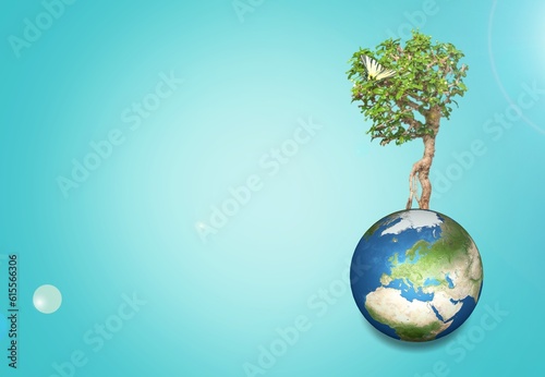 Tree growing on globe Earth on background © BillionPhotos.com