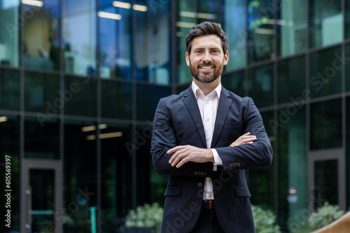Fotografie Portrait of mature adult businessman, senior boss with beard smiling and looking