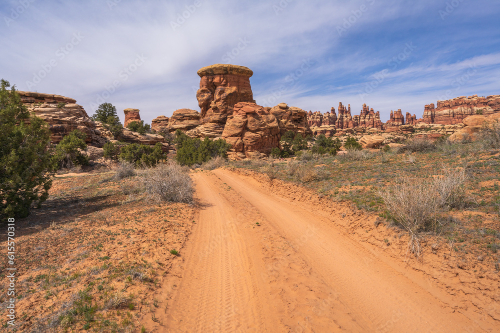 hiking the chesler park loop trail in the needles in canyonlands national park, usa hiking the chesler park loop trail in the needles in canyonlands national park, usa