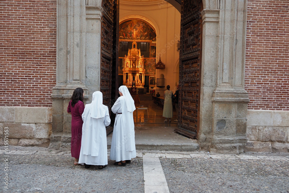 nuns at the door of a church