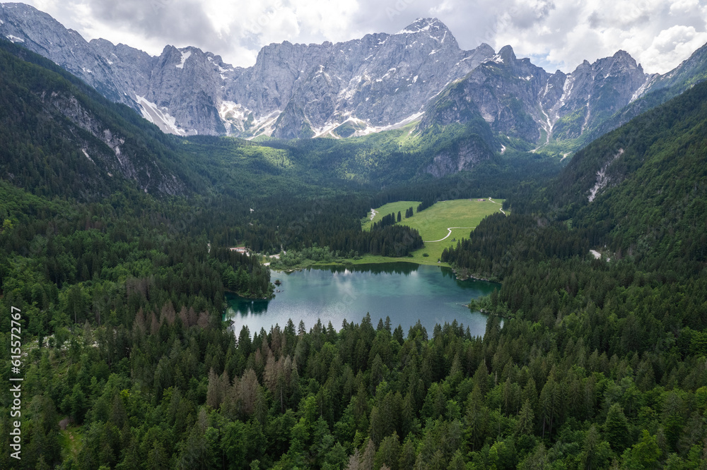 Fusine Lake in Italy with Alps mountains in background , Europe. Aerial drone view. Fusine Lake in Italy with Alps mountains in background , Europe. Aerial drone view.