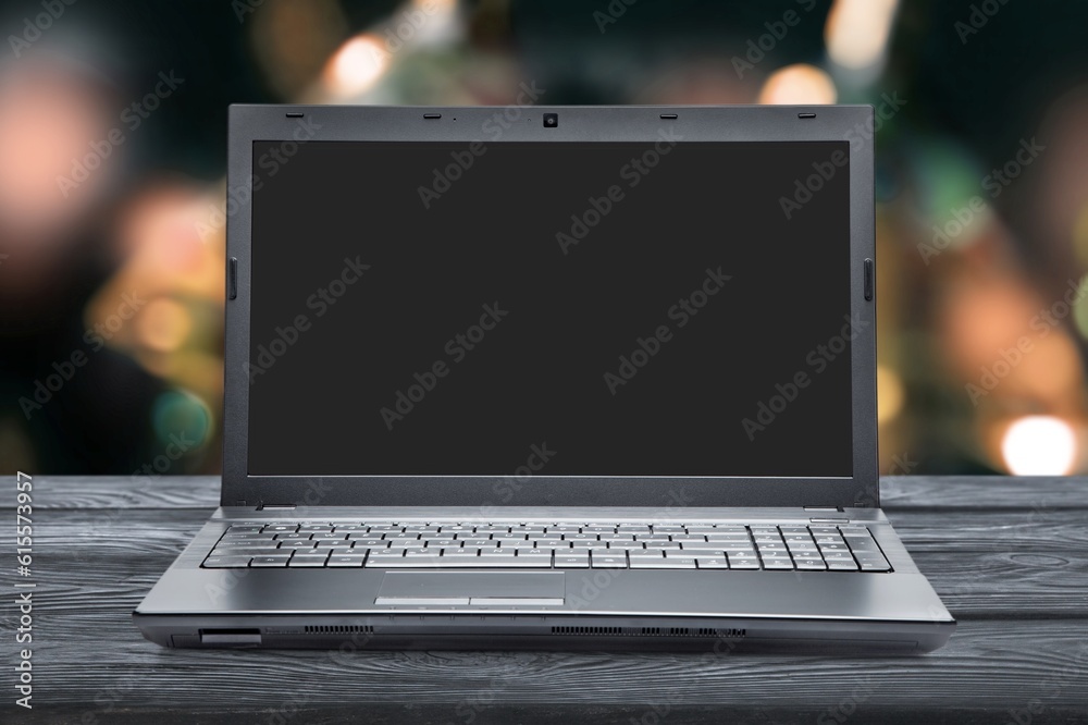 Laptop computer with a blank screen on the desk Laptop computer with a blank screen on the desk
