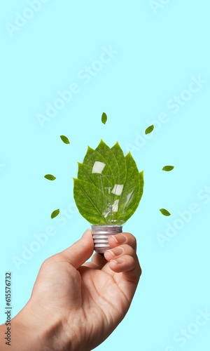 Eco-friendly concept, lightbulb with green fresh leaves
