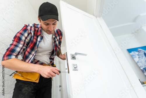 Worker Replacing House Door High