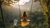 Beautiful girl enjoying freedom on swing in Bali, Indonesia