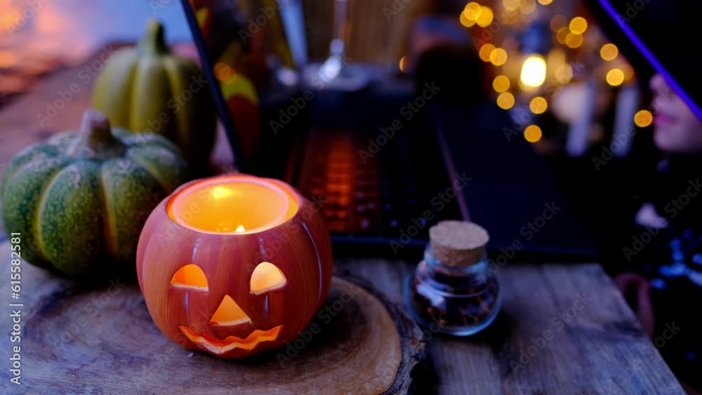 little witch, herbalist defocused, small child, girl 3 years old in witch costume and hat learns skill of magic Internet on Halloween holiday, pumpkin jack with candle, school of wizards little witch, herbalist defocused, small child, girl 3 years old in witch costume and hat learns skill of magic Internet on Halloween holiday, pumpkin jack with candle, school of wizards