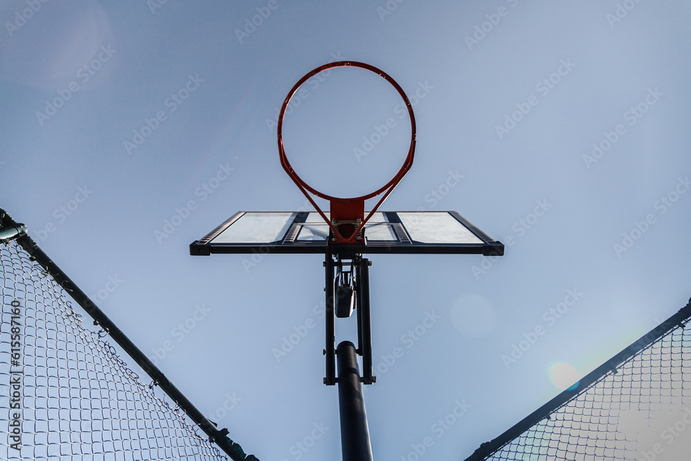 Streetball basket outdoor. Blue sky as background and copy space. bottom view. Streetball basket outdoor. Blue sky as background and copy space. bottom view.
