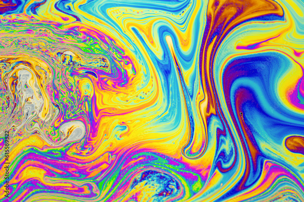 Obraz premium Psychedelic multicolored background abstract. Rainbow colors. patterns background. Photo macro shot of soap bubbles