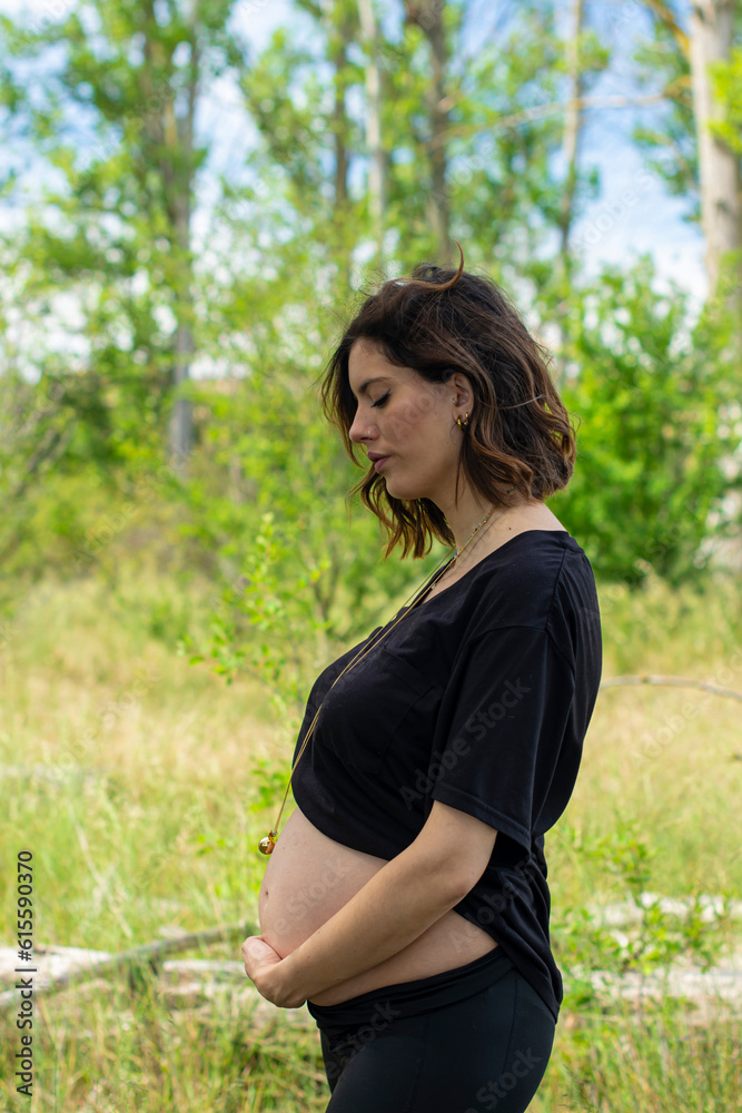 Beautiful pregnant woman enjoying nature Beautiful pregnant woman enjoying nature
