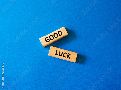 Good luck symbol. Wooden blocks with words Good luck. Beautiful blue background. Business and Good luck concept. Copy space.